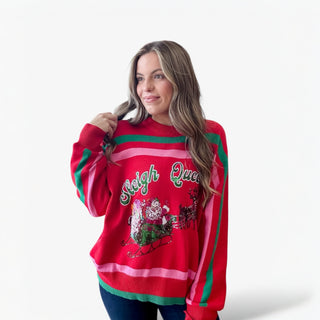 Woman wearing a red Christmas sweater with festive design on a white background