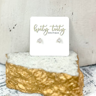 CZ fashion stud earrings with cubic zirconia stones in assorted sizes and shapes on display card