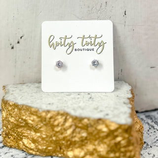 CZ fashion stud earrings with cubic zirconia stones in assorted sizes and shapes on display card