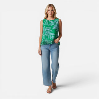 green sleeveless blouse light blue leaf print fringe hem styled with light wash wide leg jeans front view
