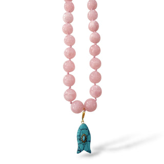     Pink fish charm necklace with glossy pink beaded strand and turquoise fish pendant on white background front view