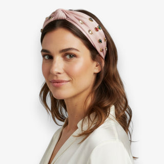 pink rhinestone headband knot style embellished multicolor gems worn with neutral outfit side view