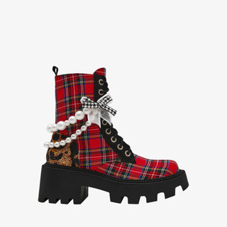 Betsey Johnson red plaid combat bootie with pearls, bows, and chunky black lug sole for bold holiday dressing