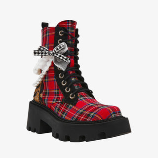 Betsey Johnson red plaid combat bootie with pearls, bows, and chunky black lug sole for bold holiday dressing