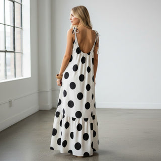 Black and white polka dot maxi dress with open back detail and tie shoulder straps back view