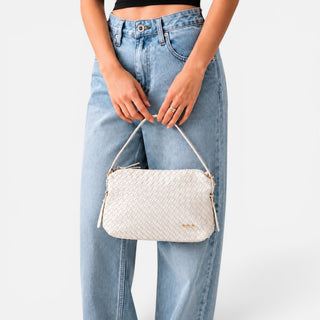 Pretty Simple Harper cream woven shoulder bag with textured vegan leather design, adjustable shoulder strap, and gold hardware front view