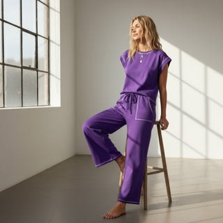 Purple scuba lounge set styled with sleeveless top and cropped wide leg pants for casual game day outfits, full view