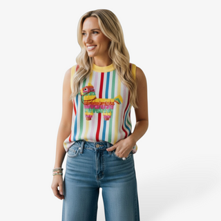 Woman wearing a colorful striped pinata sleeveless top by queen of sparkles and blue jeans on a white background