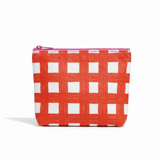 Red gingham Tyvek cosmetic bag with pink zipper angled front product view