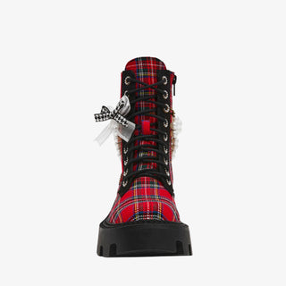 Betsey Johnson red plaid combat bootie with pearls, bows, and chunky black lug sole for bold holiday dressing