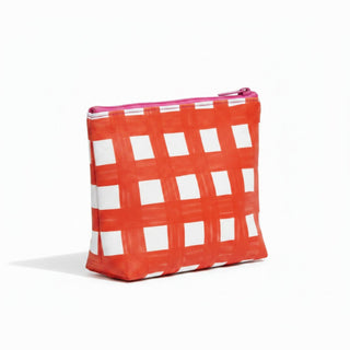 Red gingham Tyvek cosmetic bag with pink zipper side angled product view