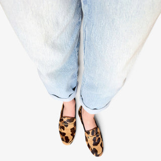 Sam Edelman Loraine leopard print Brahma hair loafer worn on model, top view showing gold bit hardware