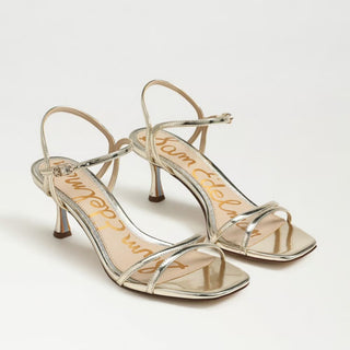 Sam Edelman glossy gold strappy kitten heel sandal with square open toe and ankle buckle front angled view