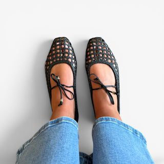 Black woven ballet flat with ankle tie detail, side and top view