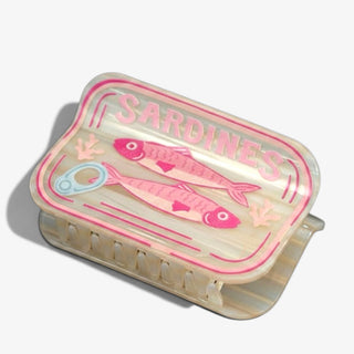 Sardine hair claw clip with pink fish can design on cream acrylic, angled front product view