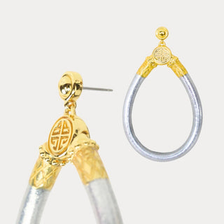 BudhaGirl Silver All Weather Earrings featuring silver teardrop hoops, gold-tone detailing, and post-back closure, close-up product view on white background