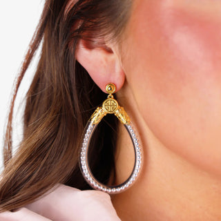 Silver BudhaGirl Bibi All Weather teardrop earrings with gold accents and beaded silver detail, shown worn on ear, side view.