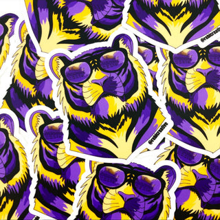 LSU tiger sticker decal with purple and gold tiger wearing sunglasses flat lay view