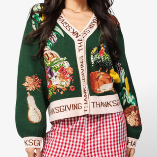 Queen of Sparkles Thanksgiving Button Cardigan in green with festive sequin food and fall motifs, featuring button-front closure and knit trim.