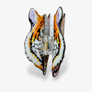Tiger head claw hair clip shown open from the side with clear spring hinge and double-sided tiger design