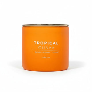 Tropical guava soy candle in bright orange matte jar with gold lid featuring tropical fruit fragrance notes front view