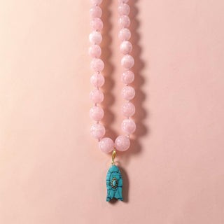 Pink beaded statement necklace with turquoise fish charm