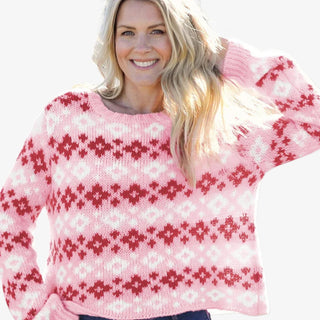 Woman wearing pink and red Fair Isle crew sweater with relaxed fit