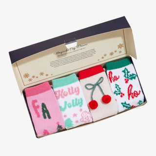Holiday Fuzzy 4-Pack Socks Gift Set featuring festive Christmas designs in pink, red, and green