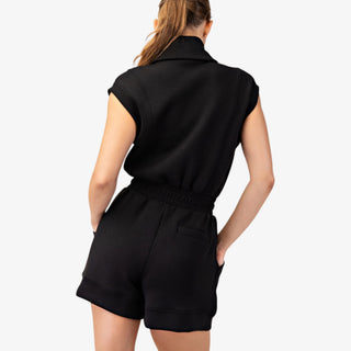 Black romper with sleeveless scuba fabric, half zip neckline, elastic waist, and front pockets for casual outfits front view