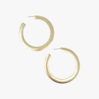 Gold hoop earrings on a white background