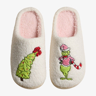 Whimsical Green Monster Slippers with pink sherpa lining and embroidered Christmas designs
