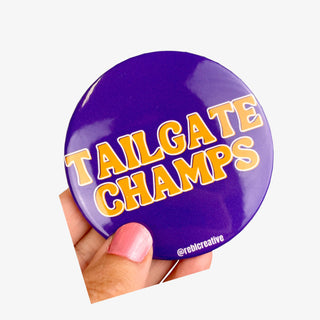 Tailgate Champs button in purple with gold lettering for LSU game day fans