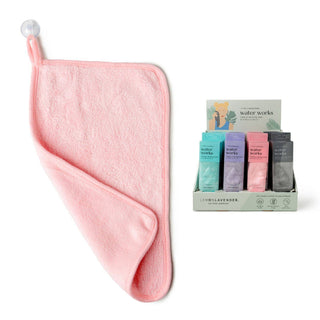 Pink towel with a display of colorful boxes labeled 'water works' on a white background