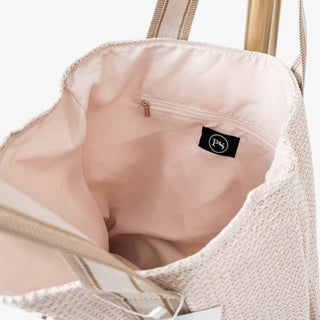 Cream raffia tote bag with beige striped shoulder straps.