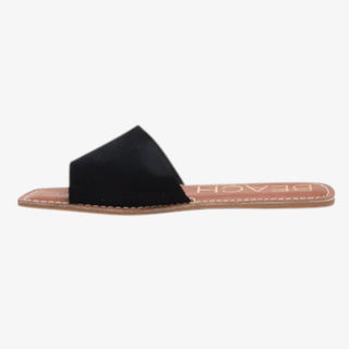 Black sandal with a tan insole on a white background