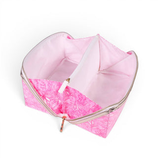 Lilly Pulitzer carryall pouch with wipeable pink interior, zipper divider pocket, and spacious cosmetic storage open view