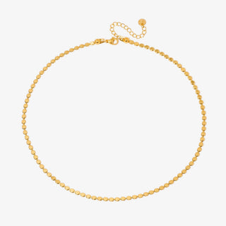 Gold disc chain necklace with adjustable extender clasp on white background product flat lay view.