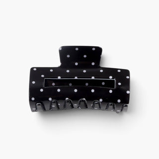 Black polka dot hair claw clip in standard 3.2-inch medium size with white dots, front product view