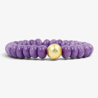 Bourbon and Boweties Kendley genuine amethyst beaded stretch bracelet with a brushed gold accent bead, shown from the front.