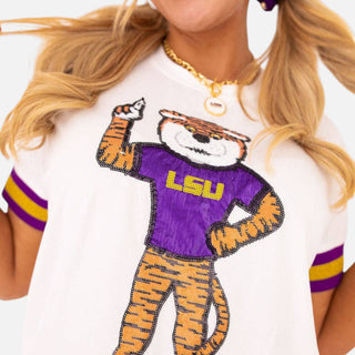 Close-up of Brianna Cannon LSU Sparkle T-shirt featuring a sequined tiger mascot in a purple LSU shirt and striped sleeves.