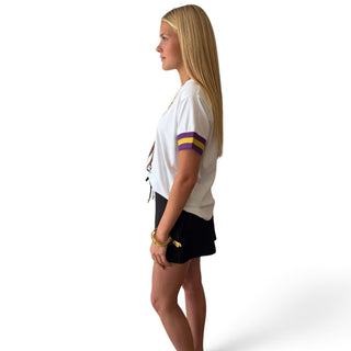 Brianna Cannon LSU white sparkle T-shirt with tiger mascot graphic and purple gold striped sleeves, side view