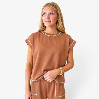 Brown Scuba Lounge Set featuring a relaxed scuba top with contrast stitching and matching pants in front detail view.