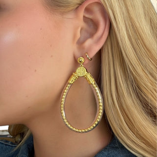 BuDhaGirl BIBI All Weather Earrings Gold with oversized teardrop shape, clear tubing and gold bead detailing, close-up worn view