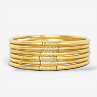 BuDhaGirl Lumine All Weather Bangles in Aura Gold set of six slim gold stackable bangles front view