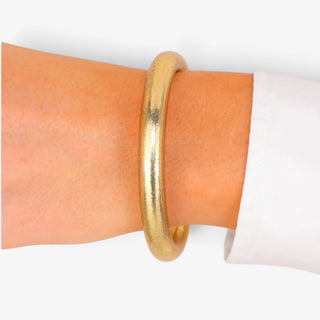 BuDhaGirl Tzubbie All Weather Bangle in Etoile gold worn on wrist, showing statement bangle size and finish