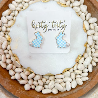 A pair of gingham patterned bunny stud earrings in blue, displayed on a card with the brand name 'Hoity Toity Boutique'.