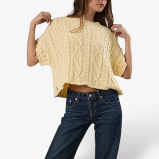 Butter yellow cable knit short sleeve sweater for women shown from the front with a relaxed boxy fit, ribbed neckline and textured design.