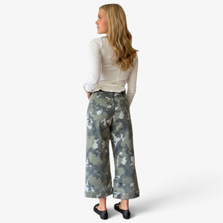 Camo cuffed wide leg jeans featuring green camouflage print, back patch pockets, cropped length and wide cuffed hems, back view.