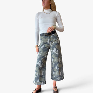 Camo cuffed wide leg jeans featuring green camouflage print, high rise waist, cropped wide legs and statement cuffed hems, front view.