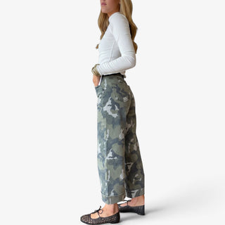 Camo cuffed wide leg jeans with green camouflage print, cropped wide leg silhouette and cuffed hem, side view.